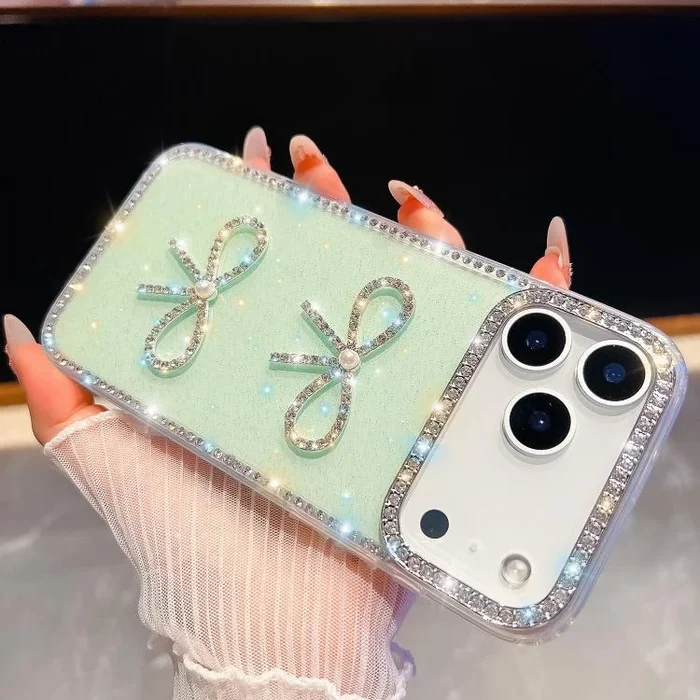 Funda antigolpes con lazo doble y purpurina de diamante para iPhone 17 Pro (verde claro)