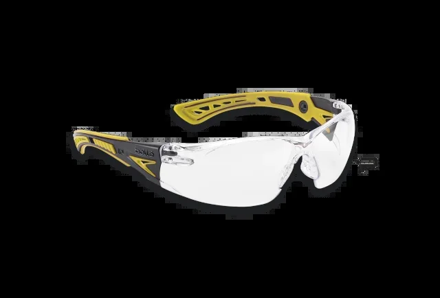 Gafas Bollé Rush de color amarillo y negro, cristal incoloro, puente nasal antideslizamiento, patillas coinyectadas ultraflexibles